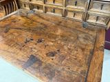 a wooden desk with many drawers and drawers on top of it