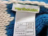blue and white knitted scarf with a label on it
