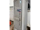 a close up of a portable toilet sitting outside of a building