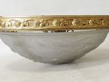an image of a silver bowl with gold decoration on the rim