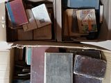 boxes of books are stacked on top of each other on a table