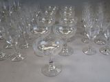 many empty wine glasses sitting on a table