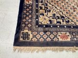 a rug on the floor with a cat laying on it