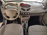 a car dashboard with a steering wheel and a clock on it