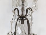 a chandelier made of glass hanging from the ceiling