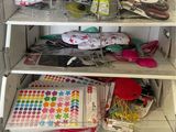 a shelf with various items in it and a kitchen utensil on it