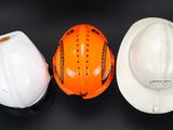 two hard hats and a hard hat are sitting on a table