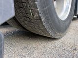 a close up of a tire on the side of a truck