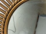 a mirror that is sitting on the wall