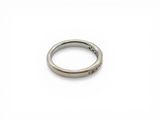 an image of a close up of a ring on a white surface