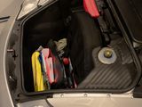a trunk of a car filled with luggage and other items