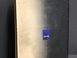 an old book with a blue label on it