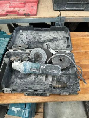 a tool box with tools in it on a table