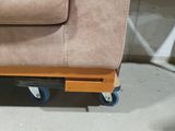 a couch that is sitting on top of a wooden pallet