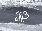 a black and white photo of a surfboarder riding a wave
