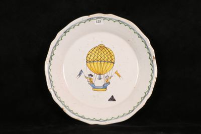 a plate with a hot air balloon painted on it