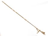 an image of a long gold necklace with a cross on it