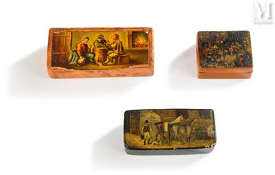 three small wooden boxes with paintings on them on a white surface