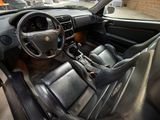 dashboard of a car with black leather seats and a steering wheel