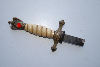 a picture of a knife with a red heart on it