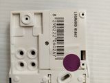 a close up of a white electronic device with a barcode on it