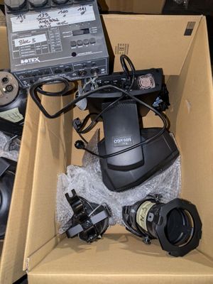 a box that has a laptop and other electronics in it