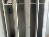 two metal lockers in the corner of a room