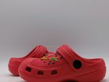 a close up of a pair of red shoes on a white surface