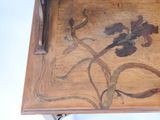 a wooden table with a floral design on it