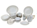 a lot of white plates and cups on the table