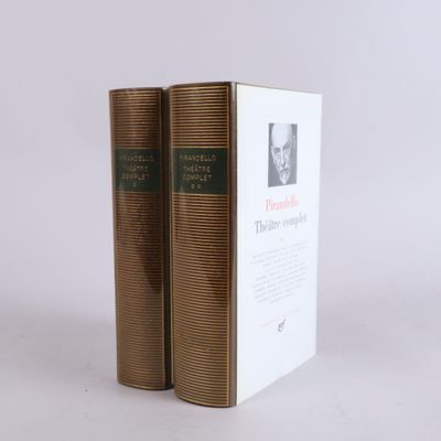 two books sitting on top of each other on a white surface