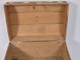 a small wooden box with a floral design on it
