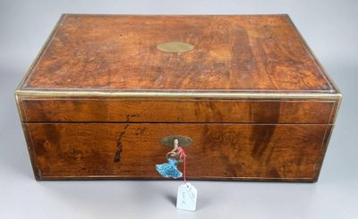 an old wooden box with a small figurine in it