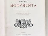 an open book with a picture of a coat of arms on it