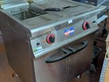 an image of a commercial fryer sitting in a warehouse