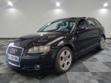 an image of a black audi wagon parked in a garage