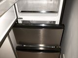 an image of a stainless steel refrigerator with its door open