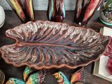 many vases and other decorative items on a table