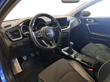 the interior of a car with a steering wheel and dashboard controls