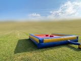 an inflatable water slide in the middle of a field