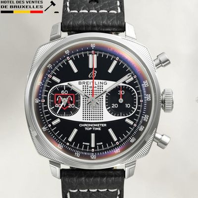 a close up of a wrist watch with a black dial