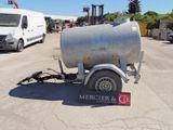 a trailer with a trailer attached to it in a parking lot