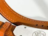 a brown leather belt with a silver buckle on it