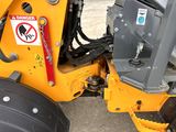 a close up of a tractor with a no parking sign on it
