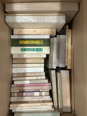 a box full of books sitting on the floor