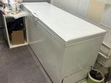 an image of a small laundry room with a washer and dryer