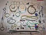 many different types of bracelets and bracelets laid out on a table