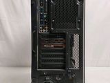 a black computer tower with a keyboard on top of it
