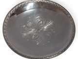 an image of a silver tray with a flower design on it