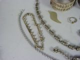 a table that has a bunch of jewelry on it